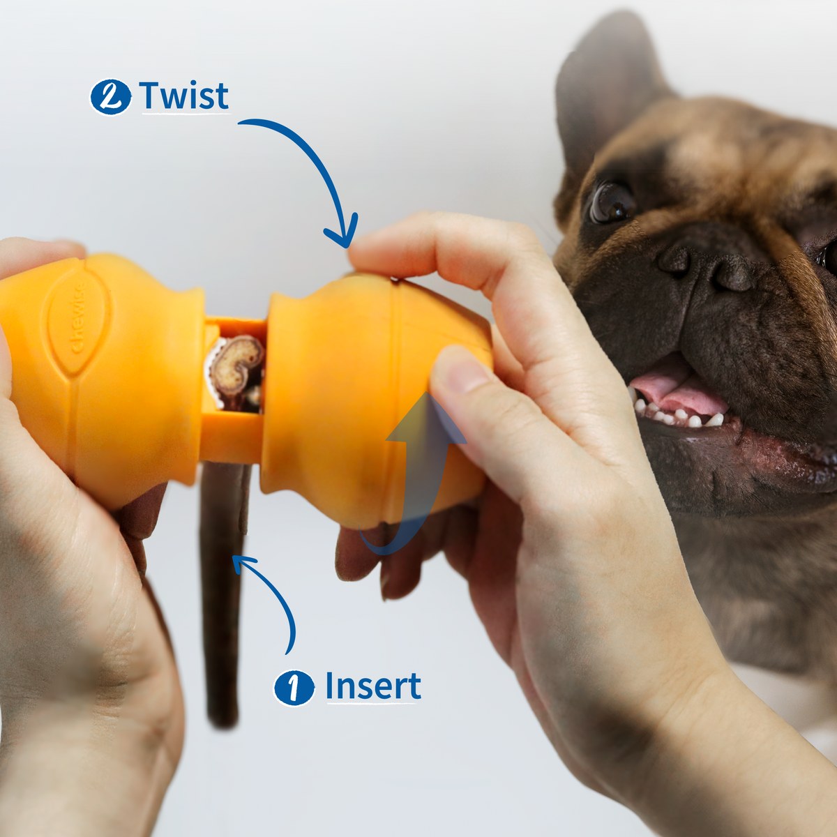 Hands inserting a bully stick into the holder and twisting it tight